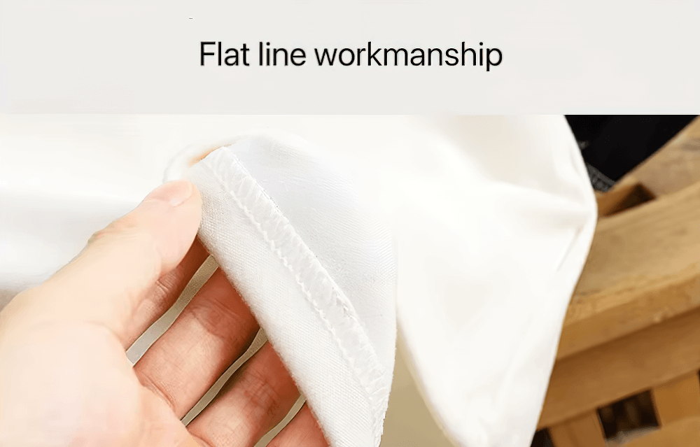 Close-up of flat line workmanship on a kid's raglan sleeve top, showcasing quality stitching and soft fabric.